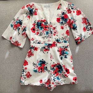 White Floral Romper with pockets and side zipper